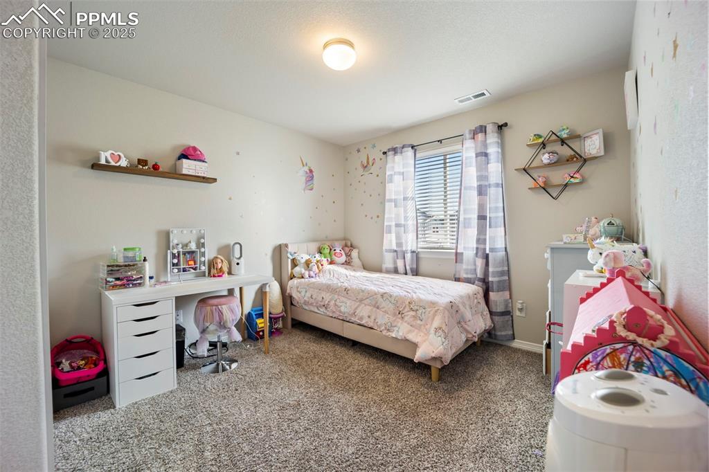 Image 14 of 45: Bedroom featuring carpet floors and baseboards