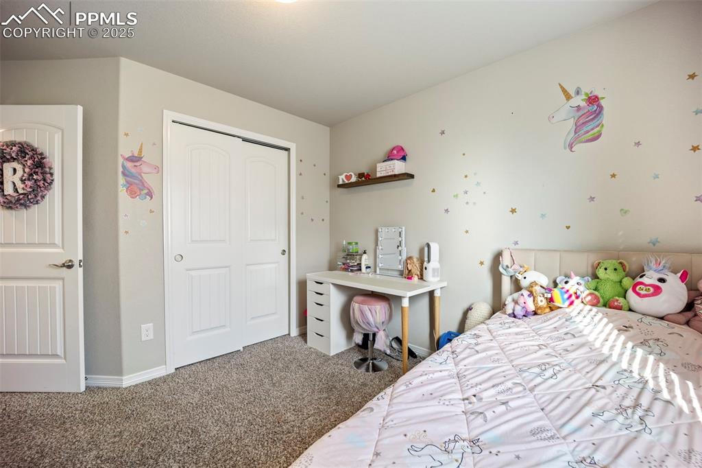 Image 15 of 45: Bedroom with carpet flooring and a closet