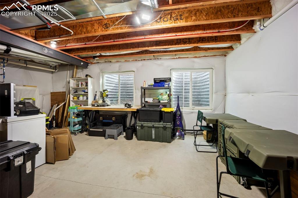 Image 24 of 45: Basement featuring a workshop area