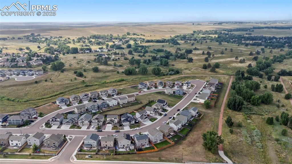 Image 38 of 45: Aerial view of property and surrounding area featuring nearby suburban area