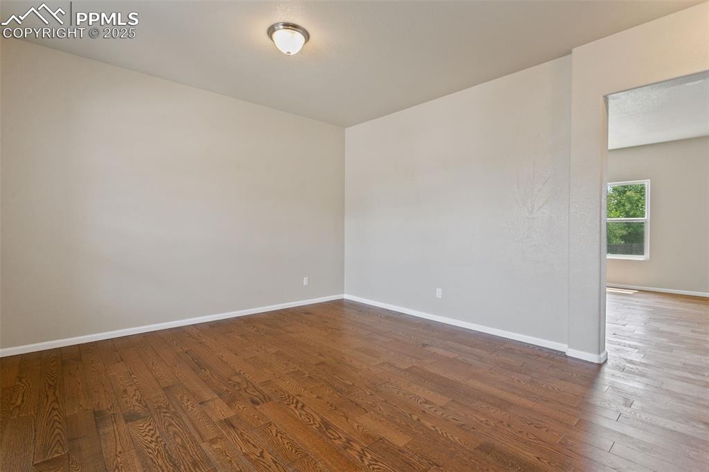 Image 4 of 41: Empty room featuring wood finished floors