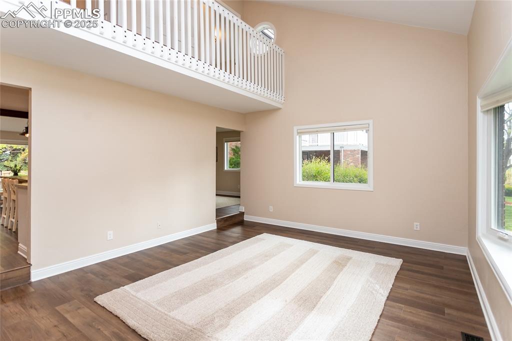 Image 10 of 50: Another view of the Living room with vaulted ceilings.