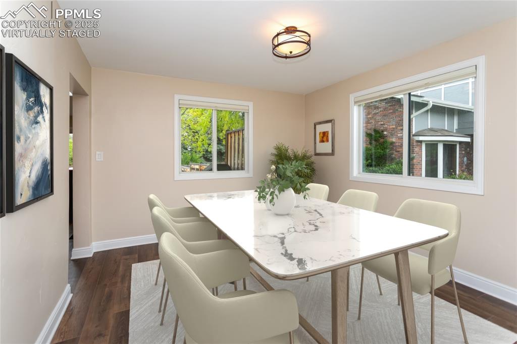Image 13 of 50: Virtually staged formal dining room.