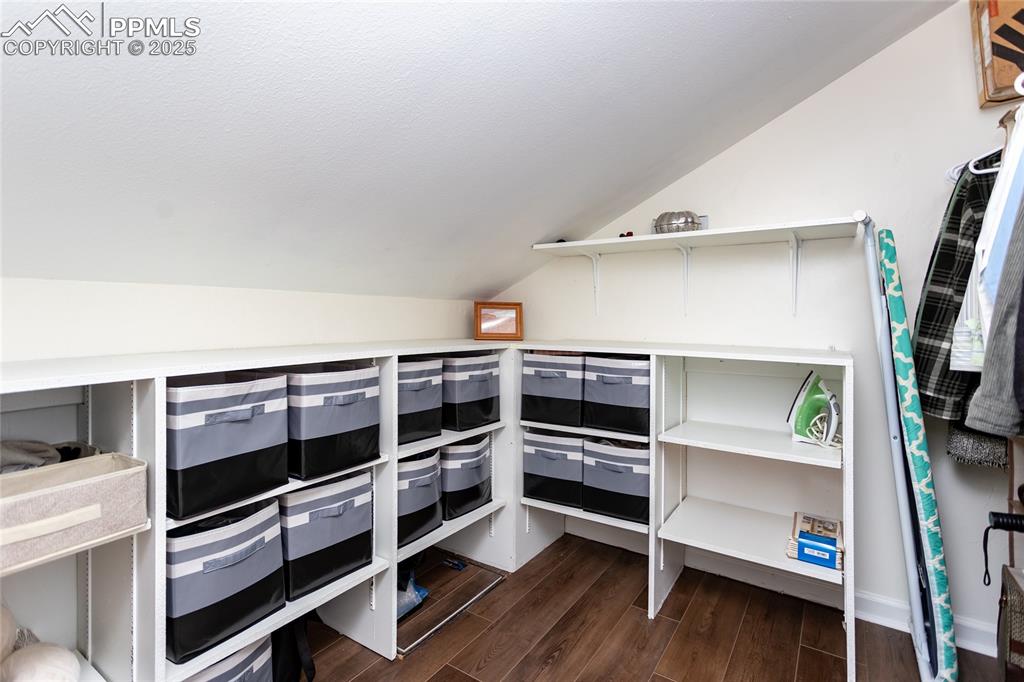 Image 26 of 50: One of the walk-in closets with built-ins.