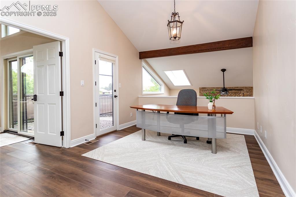 Image 33 of 50: Upstairs loft is used as an study and walks out to the upper deck.
