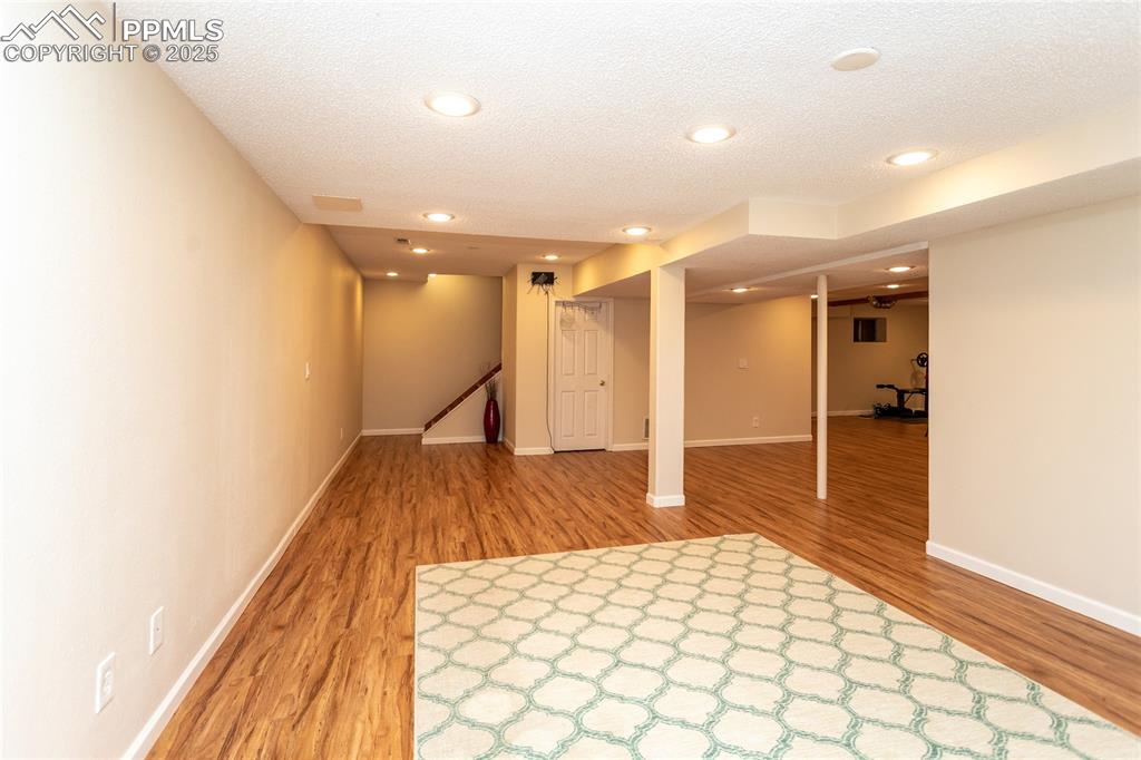 Image 44 of 50: This area of the basement is perfect for a game/pool table or exercise spac