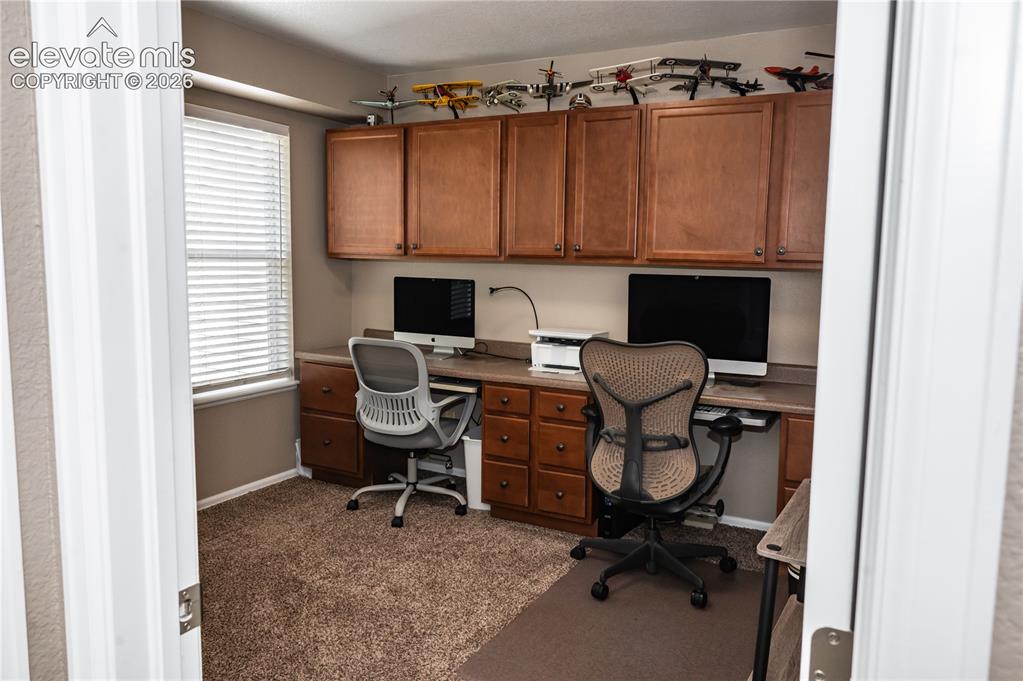 Image 29 of 34: 3rd bedroom has half wall in one side, and is currently used and configured