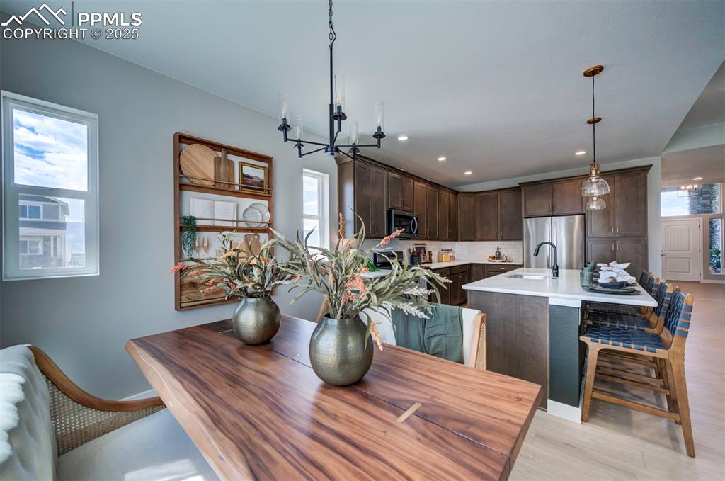 Image 15 of 44: Dining space featuring recessed lighting, light wood-style flooring, and a