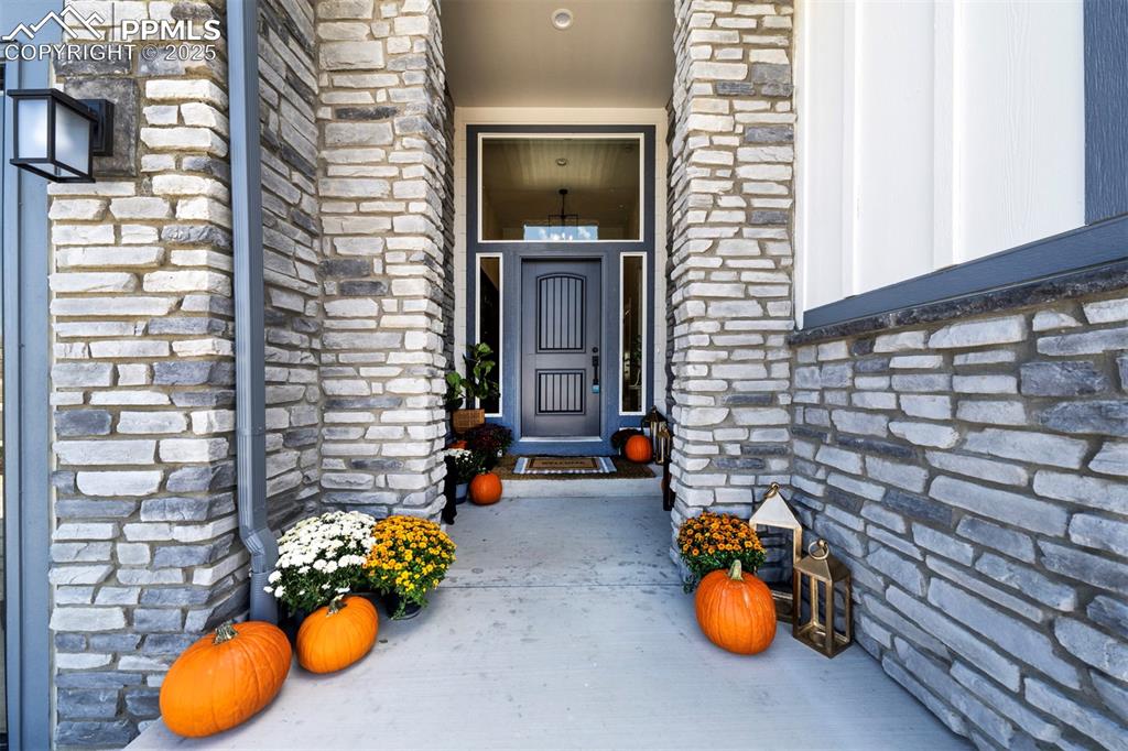 Image 2 of 44: View of exterior entry featuring stone siding