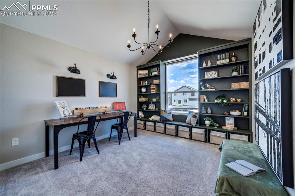 Image 20 of 44: Home office with carpet floors, baseboards, a notable chandelier, and vault