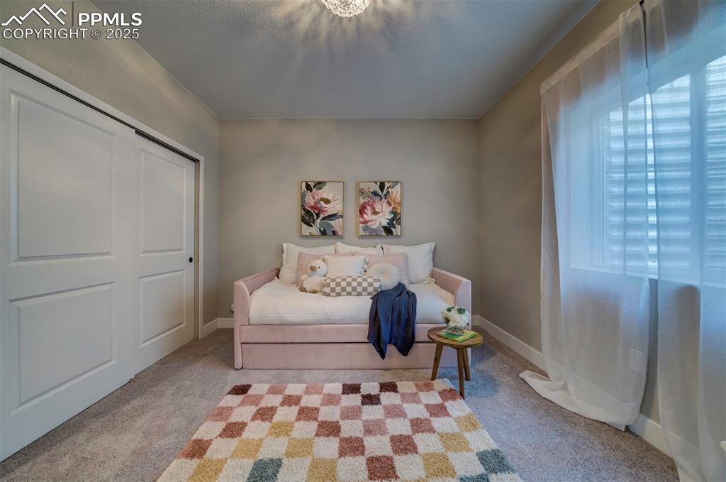 Image 29 of 44: Carpeted bedroom with baseboards and a closet