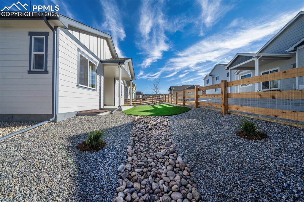 Image 4 of 44: View of yard featuring a fenced backyard