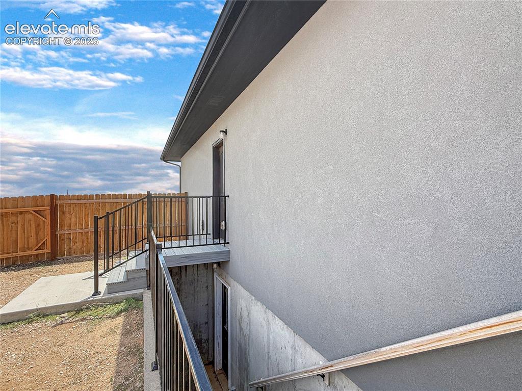 Image 31 of 41: Walkout from main level bathroom and basement