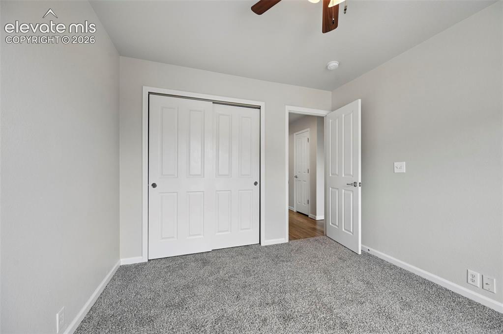 Image 14 of 33: Room featuring gray carpet flooring, light gray wall paint, and white trim