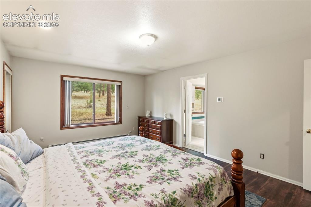Image 15 of 29: Primary bedroom retreat with direct access to the five piece bathroom and w