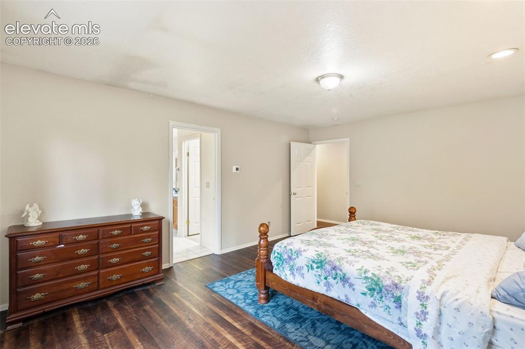 Image 16 of 29: Generous primary suite featuring ample space for furnishings and a comforta