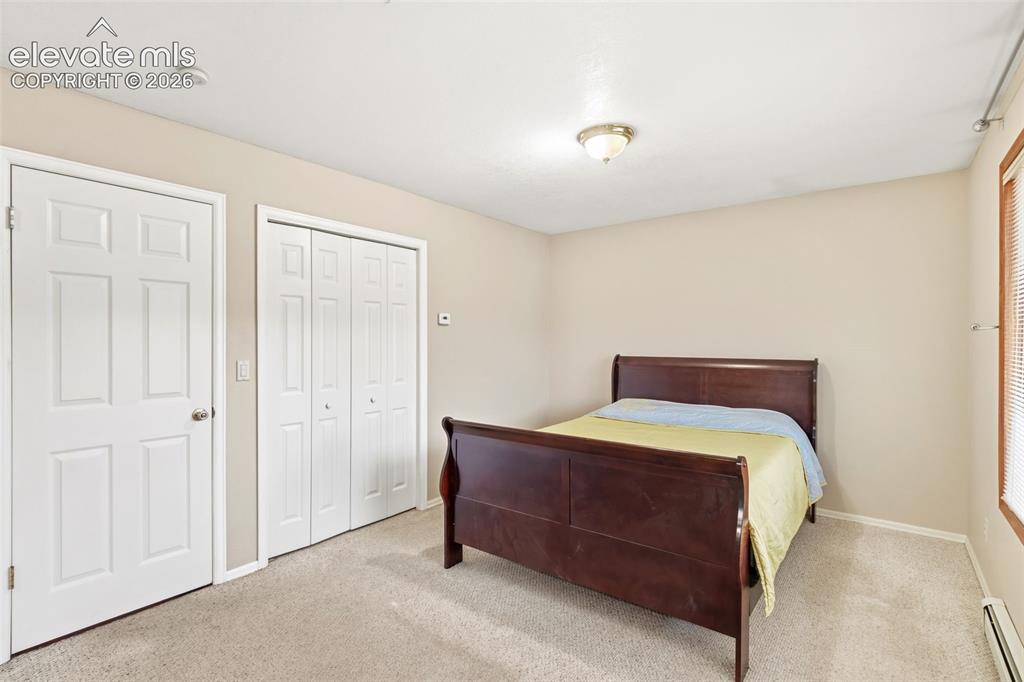 Image 23 of 29: Large secondary bedroom featuring dual closet spaces and flexible layout po
