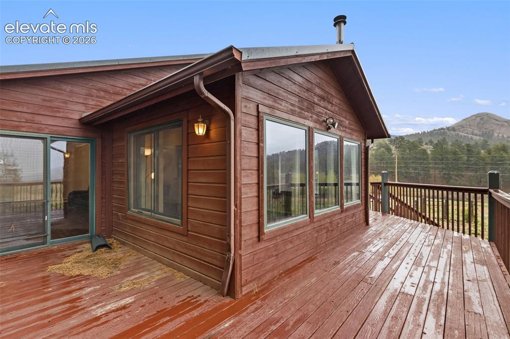Image 3 of 29: Large deck space with views of iconic Dome Rock and surrounding mountain la