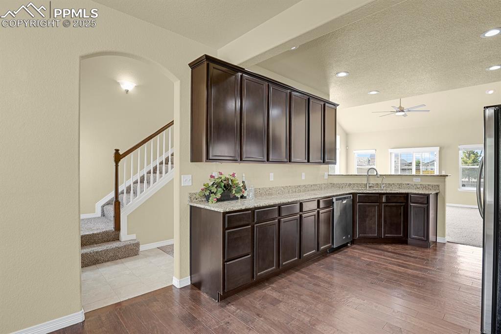 Image 11 of 33: Another view of spacious kitchen. 