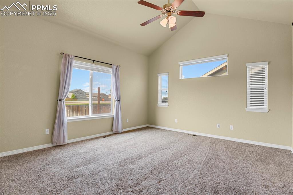 Image 18 of 33: Spacious and private main level master suite with beautiful views of the lu