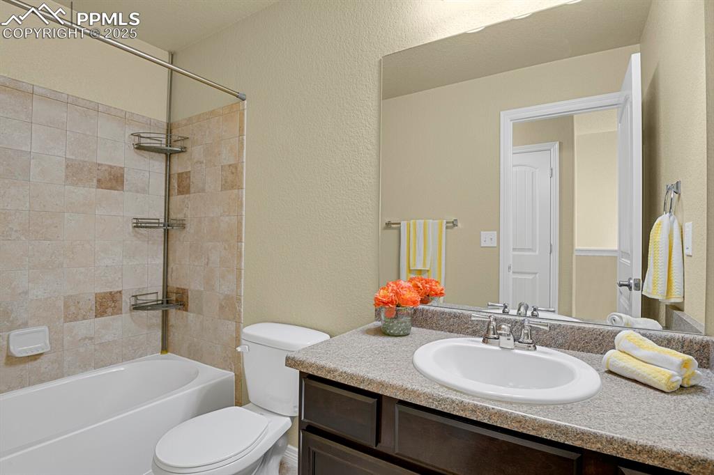 Image 27 of 33: Upper level full bathroom. 