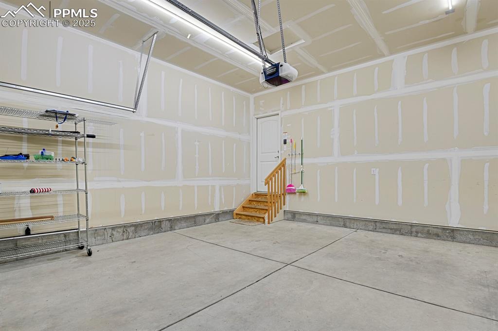 Image 30 of 33: Fully finished garage with 50 AMP Level 2 EV Charger. 