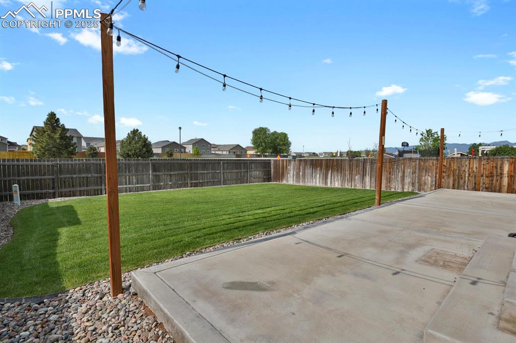 Image 5 of 33: Expansive 37x11 concrete patio with ambient lighting ideal for entertaining