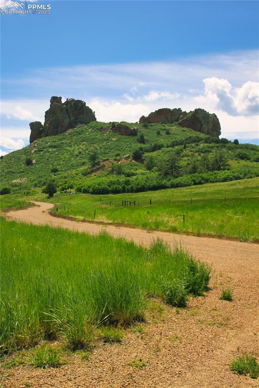 Image 5 of 8: View of mountain backdrop featuring rural landscape