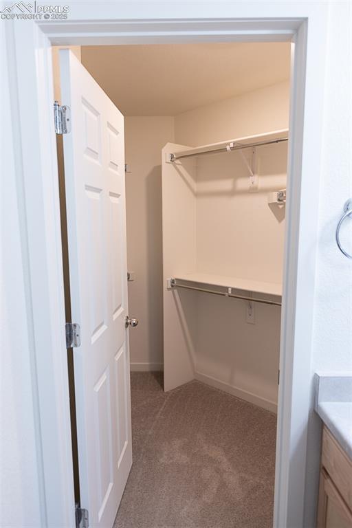 Image 22 of 37: Primary closet