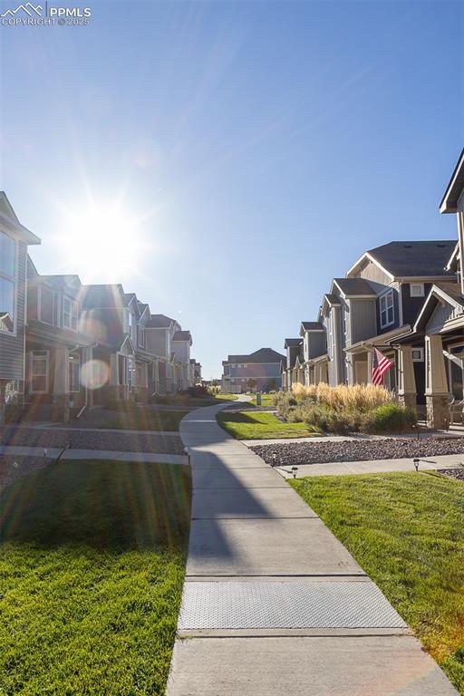Image 5 of 37: long open corridor between home entries