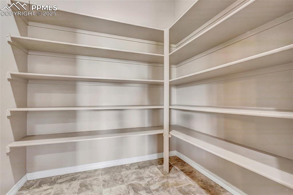 Image 16 of 50: Large pantry off of the kitchen