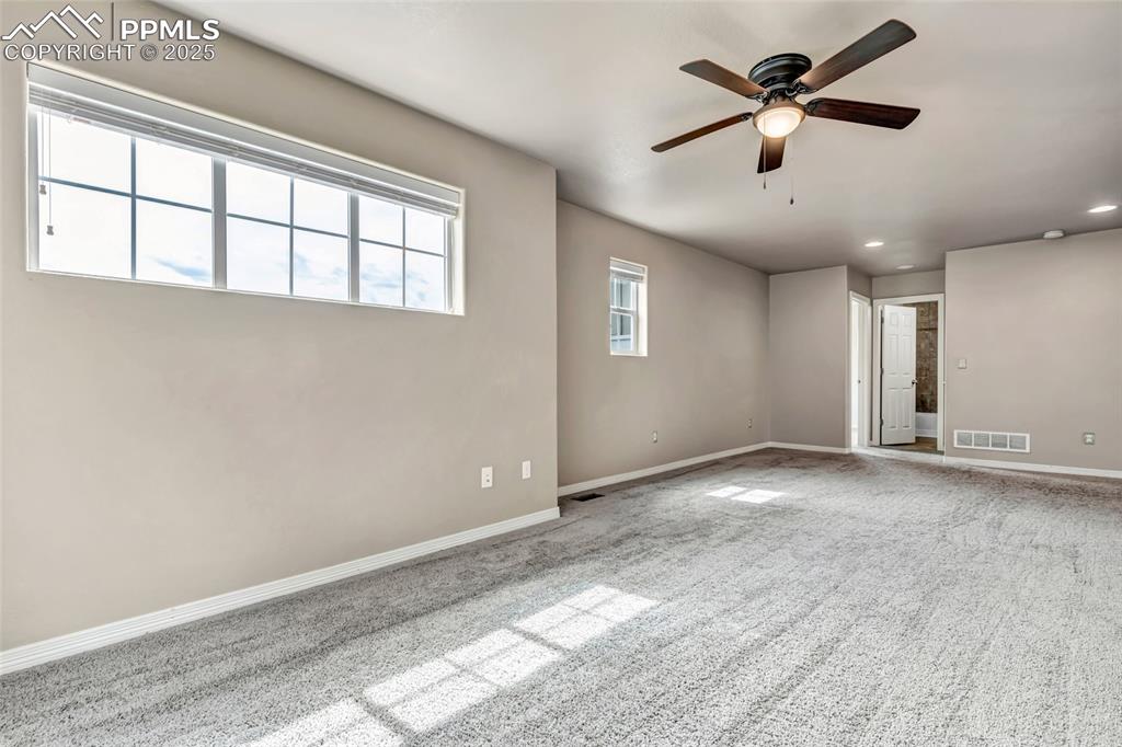 Image 20 of 50: Unfurnished room with carpet, a ceiling fan, and recessed lighting