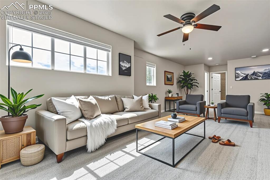 Image 21 of 50: Virtually Staged - Living area featuring a ceiling fan, recessed lighting, 
