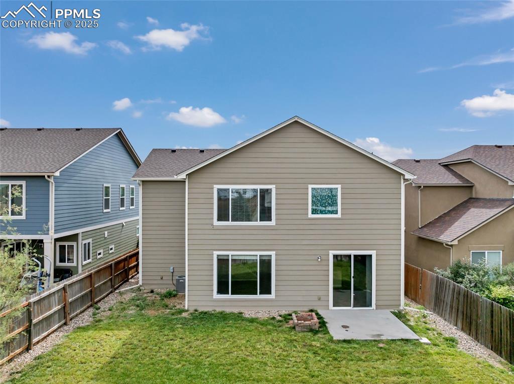 Image 43 of 50: Rear view of property with a patio area and a fenced backyard