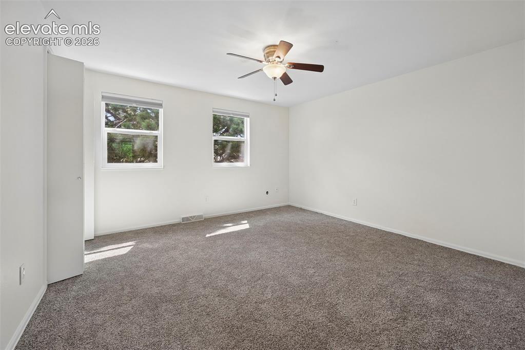 Image 18 of 27: Unstaged bedroom