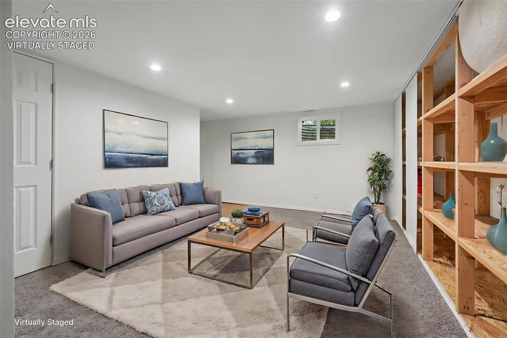Image 21 of 27: Virtually staged living room in basement