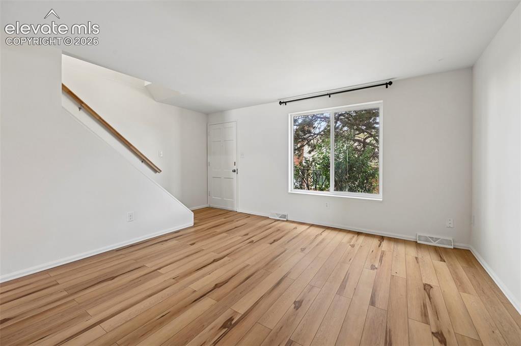 Image 5 of 27: Living room, looking towards front door