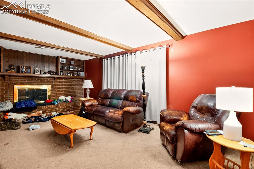 Image 15 of 44: Living room with fireplace