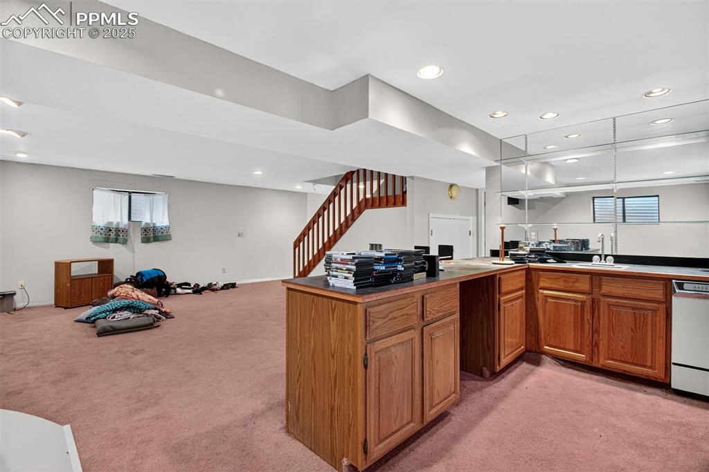 Image 28 of 44: Wet bar lower level