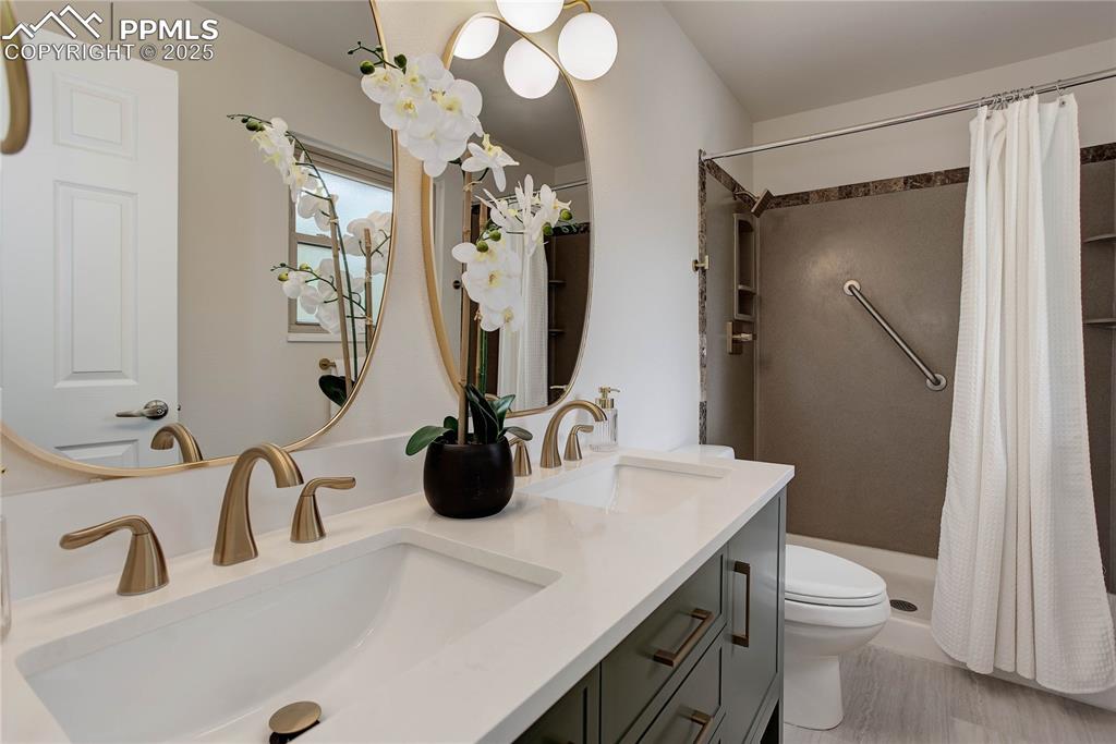 Image 11 of 28: Primary bath with dual sink vanity