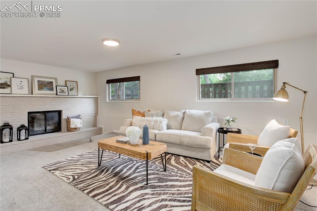 Image 19 of 28: Family room w/ fireplace