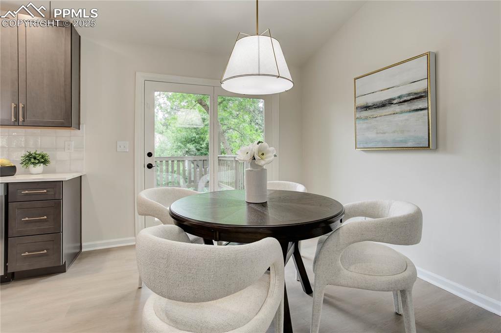 Image 7 of 28: Dining area with walk-out