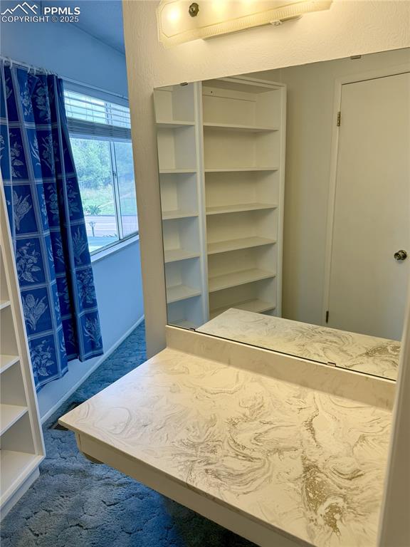 Image 14 of 33: Third counter space in primary bathroom