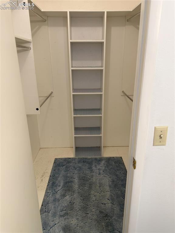 Image 15 of 33: One of two walk in closets in primary suite