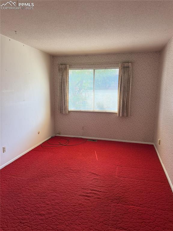 Image 18 of 33: Bedroom 2 on upper level with walk in closet