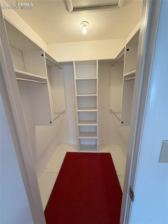 Image 19 of 33: View of walk in closet