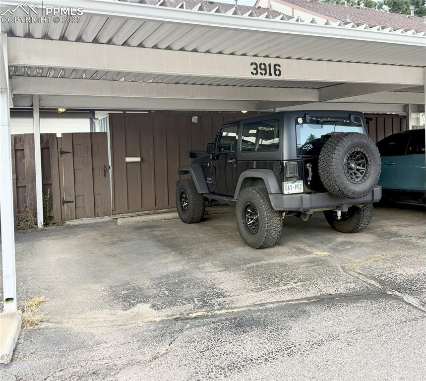 Image 29 of 33: 2 car assigned carport