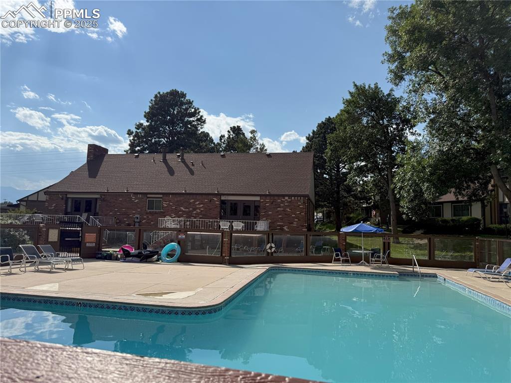 Image 33 of 33: Community pool with view of clubhouse