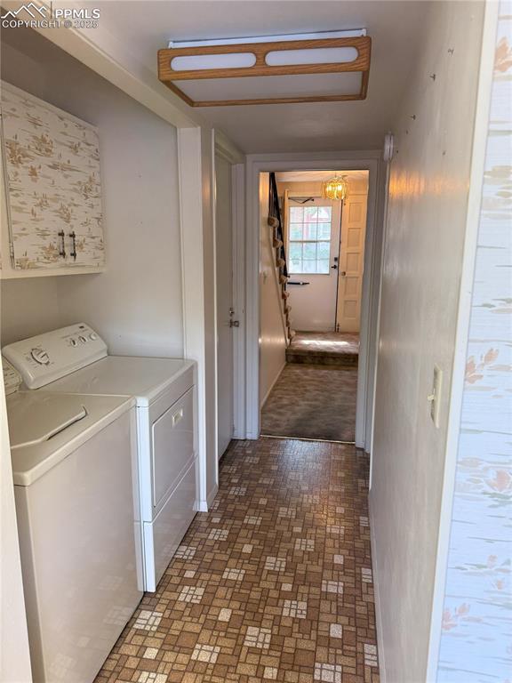 Image 4 of 33: View from kitchen to front entry