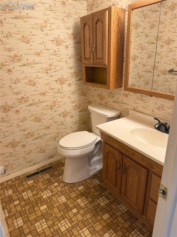 Image 6 of 33: Main level half bathroom